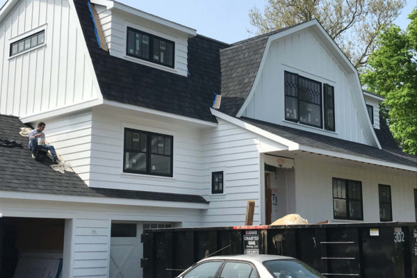 Custom home board and batten siding with PVC trim and moulding